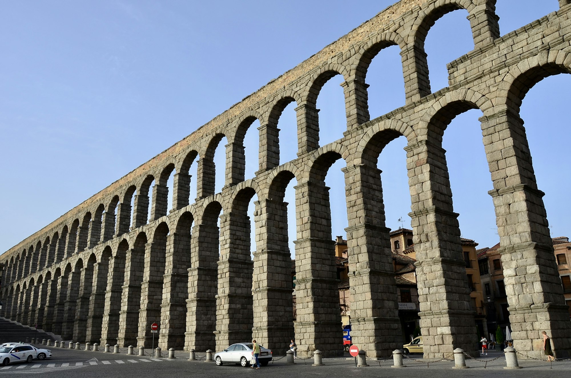 The Aqueduct of Segovia, its double tier of granite arches carrying a water channel across the city.