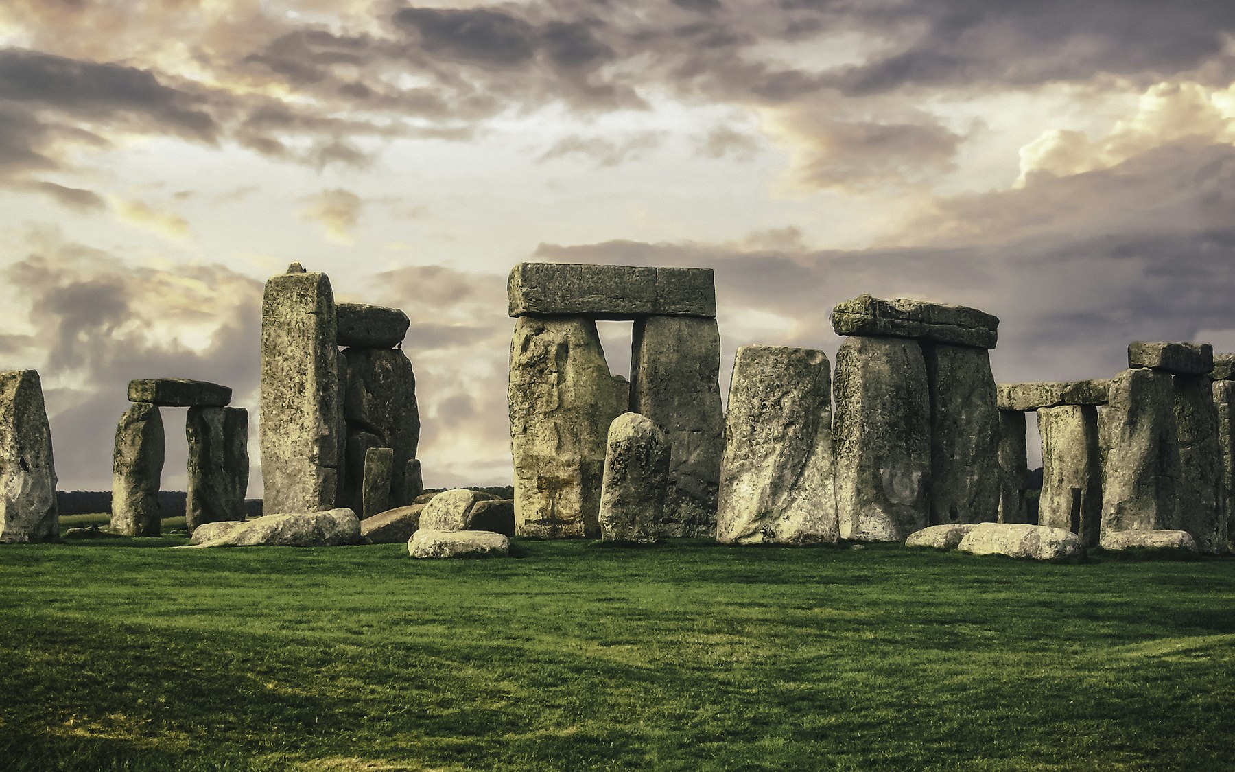 The sarsen circle at Stonehenge, its lintels still seated on their uprights.